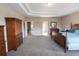 Large main bedroom features tray ceiling, carpet flooring, and plenty of room for furniture at 4162 Roberts Crest Dr, Suwanee, GA 30024