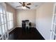 Spacious office space with hardwood floors, fan, and natural light at 4162 Roberts Crest Dr, Suwanee, GA 30024