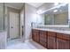 Elegant bathroom with double sink vanity, granite countertops and tile floor at 12 Candler Grove Dr, Decatur, GA 30030