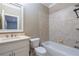 Cozy bathroom with a tub and shower combo and neutral tile at 12 Candler Grove Dr, Decatur, GA 30030