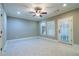 Versatile bonus room with tile flooring, ceiling fan and access to the outdoors at 12 Candler Grove Dr, Decatur, GA 30030