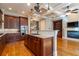 Modern kitchen featuring wood cabinets, granite countertops, a kitchen island, and stainless steel appliances at 12 Candler Grove Dr, Decatur, GA 30030