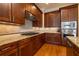 Well-equipped kitchen with granite countertops, wooden cabinetry, stainless steel appliances, and tile backsplash at 12 Candler Grove Dr, Decatur, GA 30030