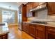 View of the kitchen cabinets, backsplash, stainless appliances, granite countertops, and hardwood floors at 12 Candler Grove Dr, Decatur, GA 30030