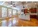 Bright, spacious kitchen with wooden floors, cabinetry, stainless steel appliances, and a coffered ceiling at 12 Candler Grove Dr, Decatur, GA 30030