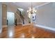 Open floor plan with hardwood floors, a staircase, and a fireplace, creating an inviting and spacious living area at 12 Candler Grove Dr, Decatur, GA 30030