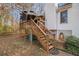 The back deck is accessed via wooden steps and features an awning to provide shade at 2033 Old Newnan Rd, Carrollton, GA 30116