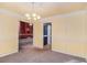 Dining room with classic decor leading into an adjacent room, providing an open and inviting layout at 2033 Old Newnan Rd, Carrollton, GA 30116