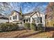 Well-maintained home featuring trimmed hedges, a covered entryway, and a fenced yard at 2033 Old Newnan Rd, Carrollton, GA 30116