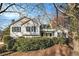 Inviting home exterior with lush landscaping and a quaint covered front porch at 2033 Old Newnan Rd, Carrollton, GA 30116
