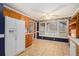 Spacious kitchen and eating area with large window, patterned floor and white refrigerator at 2033 Old Newnan Rd, Carrollton, GA 30116