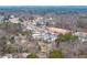 Wide aerial view of a town with greenery, roads, train tracks and residential housing at 4374 Westside Nw Dr, Acworth, GA 30101