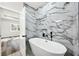 Bathroom features modern tub and marble-look shower at 4374 Westside Nw Dr, Acworth, GA 30101