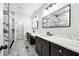 Bathroom with marble-look walk-in shower, stylish cabinets, and double vanity at 4374 Westside Nw Dr, Acworth, GA 30101