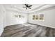 A bright bedroom features many windows, a ceiling fan, and stylish floors at 4374 Westside Nw Dr, Acworth, GA 30101