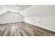 Attic bedroom with light walls and flooring, window, and a door to storage at 4374 Westside Nw Dr, Acworth, GA 30101