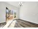 Dining area featuring wood-look floors and a glass door at 4374 Westside Nw Dr, Acworth, GA 30101
