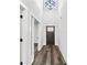 Entryway featuring hardwood floors, a statement light fixture, and modern molding at 4374 Westside Nw Dr, Acworth, GA 30101