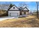 Charming new construction home with a covered porch, craftsman details, and an attached garage at 4374 Westside Nw Dr, Acworth, GA 30101