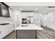 Bright kitchen with stainless steel appliances and a center island with quartz countertop at 4374 Westside Nw Dr, Acworth, GA 30101