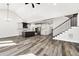 Open-concept kitchen with stainless appliances, dark island, and stylish countertops at 4374 Westside Nw Dr, Acworth, GA 30101