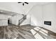 Open-concept living space with fireplace and staircase at 4374 Westside Nw Dr, Acworth, GA 30101