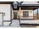 Covered front porch featuring craftsman-style wood columns and black metal railings at 4374 Westside Nw Dr, Acworth, GA 30101