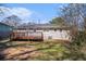 Backyard with wooden deck, brick house, and patchy lawn at 2753 Wedgewood Ter, Decatur, GA 30032