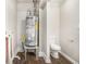 Basement featuring a water heater, toilet, and wood-look flooring at 2753 Wedgewood Ter, Decatur, GA 30032