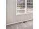 Bedroom featuring soft grey carpet, neutral walls, and natural light from a large window at 2753 Wedgewood Ter, Decatur, GA 30032