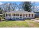 Charming single-story home featuring a cozy front porch and well-maintained lawn at 2753 Wedgewood Ter, Decatur, GA 30032