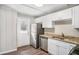 Updated kitchen featuring stainless steel appliances, granite countertops, and white cabinets at 2753 Wedgewood Ter, Decatur, GA 30032
