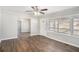 Cozy living room with new hardwood floors, ceiling fan, and a view into the dining room at 2753 Wedgewood Ter, Decatur, GA 30032