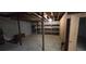 Unfinished basement featuring concrete floors, exposed ceiling, and shelving for ample storage at 3640 Chandler Haulk Rd, Loganville, GA 30052