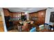 Spacious kitchen with wooden cabinets, granite countertops, stainless steel appliances, and a center island at 3640 Chandler Haulk Rd, Loganville, GA 30052