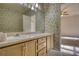 Bathroom featuring a double sink vanity and decorative wallpaper at 424 Cannonball Ct, Stockbridge, GA 30281
