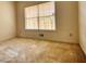 Bedroom with tan carpet, neutral wall paint and natural light from a window at 424 Cannonball Ct, Stockbridge, GA 30281
