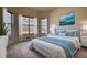 Sun-filled bedroom with a cozy bed, large windows, and stylish decor at 424 Cannonball Ct, Stockbridge, GA 30281