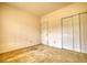 A well-lit bedroom is equipped with a double closet providing efficient storage options at 424 Cannonball Ct, Stockbridge, GA 30281