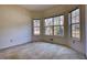 Bright bedroom featuring carpeted floors and large windows offering natural light at 424 Cannonball Ct, Stockbridge, GA 30281