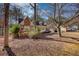 Charming home with brick details, cozy front porch, and mature trees providing shade and privacy at 424 Cannonball Ct, Stockbridge, GA 30281