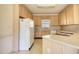 Functional kitchen with light wood cabinets, and essential appliances at 424 Cannonball Ct, Stockbridge, GA 30281