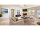 Bright living room with a fireplace, neutral carpet, and a serene view of the outside at 424 Cannonball Ct, Stockbridge, GA 30281
