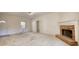 Spacious living room with a brick fireplace, neutral carpet, and access to other rooms at 424 Cannonball Ct, Stockbridge, GA 30281