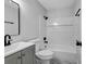 Cozy bathroom with a shower-tub combination and classic fixtures at 2390 Amberbrook Sw Dr, Conyers, GA 30094