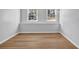 Bright bedroom with wood flooring and natural light from the double windows at 2390 Amberbrook Sw Dr, Conyers, GA 30094