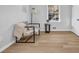 Bedroom featuring natural light, modern furnishings, and wood-look flooring at 2390 Amberbrook Sw Dr, Conyers, GA 30094