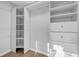Well-organized walk-in closet with custom shelving and ample storage space at 2390 Amberbrook Sw Dr, Conyers, GA 30094