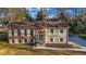 Front exterior of a two-story house with brick and siding, situated on a grassy lot at 2390 Amberbrook Sw Dr, Conyers, GA 30094