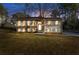 Charming two-story home featuring a well-manicured lawn, brick accents, symmetrical design, and a welcoming entrance at 2390 Amberbrook Sw Dr, Conyers, GA 30094